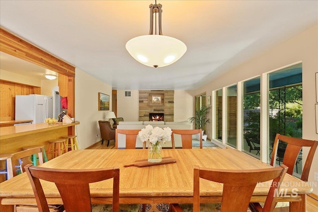 424 N Mobley Dr, Boise, ID 83712 - dining area with a fireplace and light wood finished floors