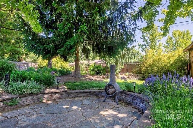 424 N Mobley Dr, Boise, ID 83712 - fenced backyard with a patio area