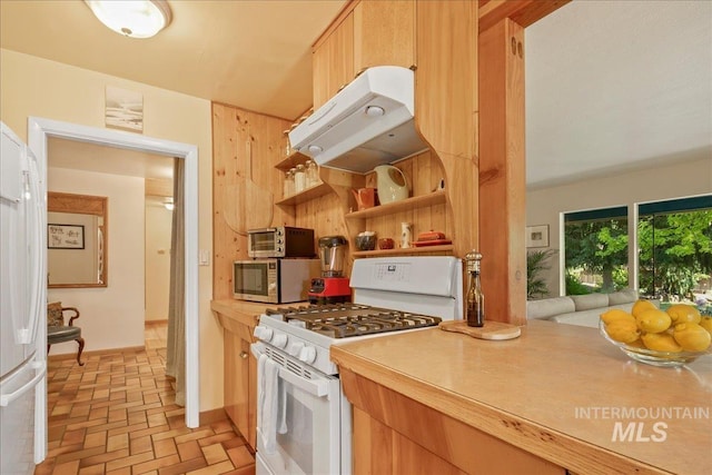 424 N Mobley Dr, Boise, ID 83712 - kitchen featuring white appliances, extractor fan, brick floors, light countertops, and baseboards