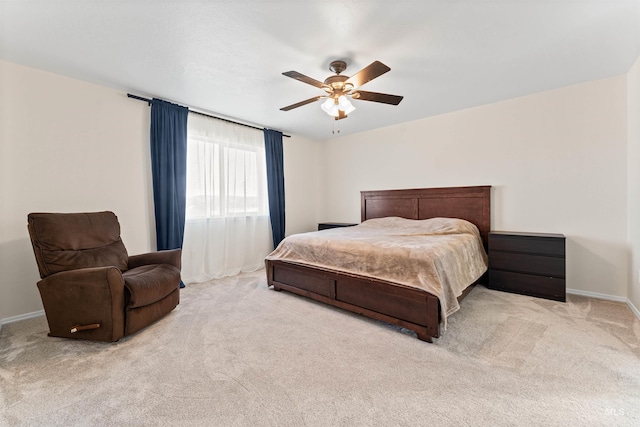 bedroom featuring baseboards, a ceiling fan, and carpet floors