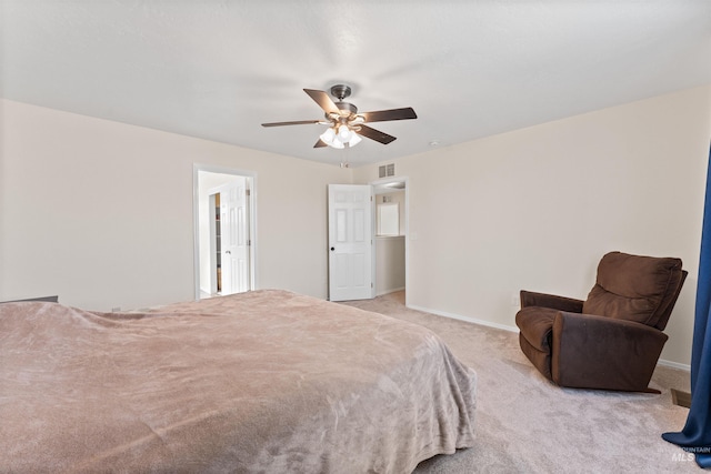 carpeted bedroom featuring visible vents, baseboards, and ceiling fan
