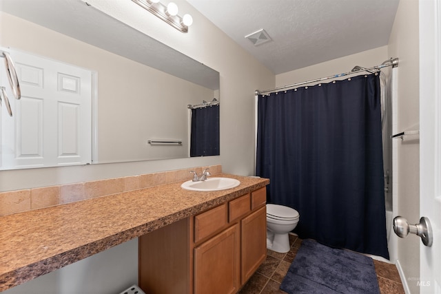 full bathroom featuring visible vents, a shower with shower curtain, toilet, vanity, and tile patterned floors