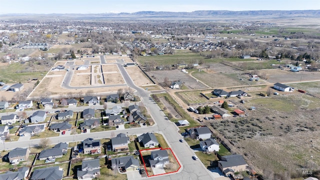 drone / aerial view with a residential view and a mountain view