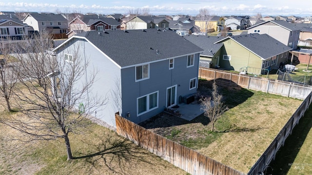 birds eye view of property with a residential view
