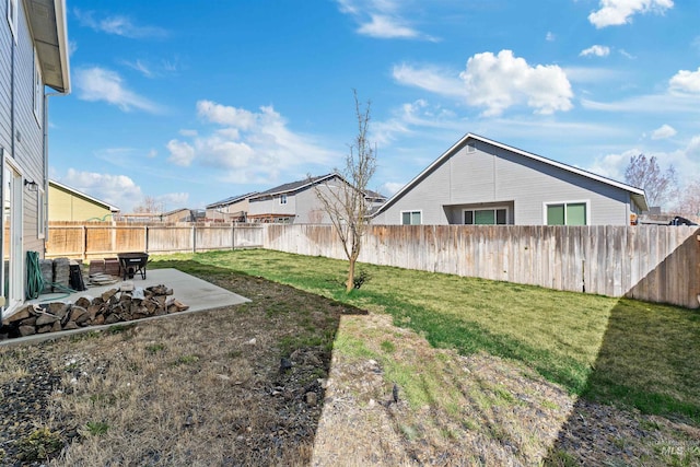 view of yard featuring a fenced backyard and a patio