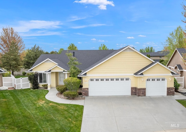 view of front facade featuring fence, concrete driveway, a front yard, and brick siding
