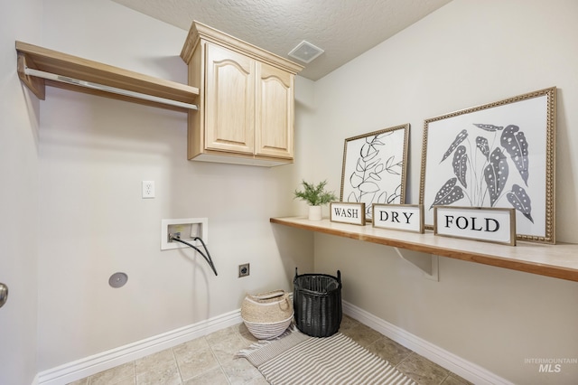 washroom with cabinet space, hookup for an electric dryer, baseboards, and washer hookup