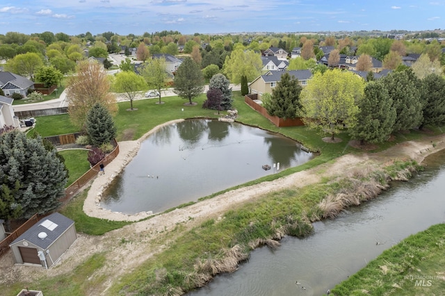 bird's eye view with a residential view and a water view