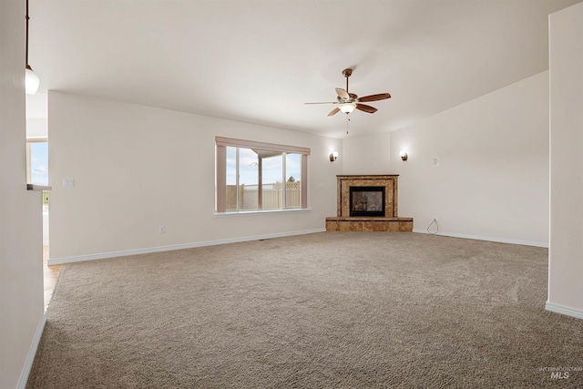 1041 Lupine Ln, Kimberly, ID 83341 - unfurnished living room with a ceiling fan, carpet floors, and a glass covered fireplace