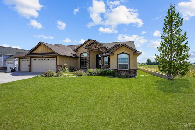 1041 Lupine Ln, Kimberly, ID 83341 - view of front of property featuring stone siding, a garage, stucco siding, and a front lawn