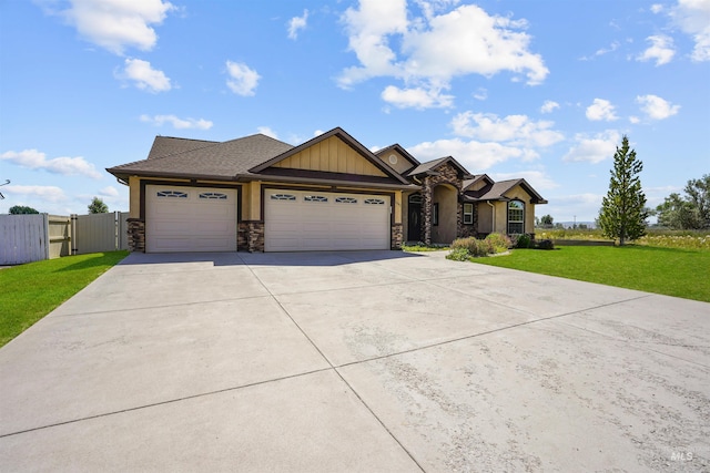 1041 Lupine Ln, Kimberly, ID 83341 - view of front facade featuring stone siding, an attached garage, concrete driveway, and a gate