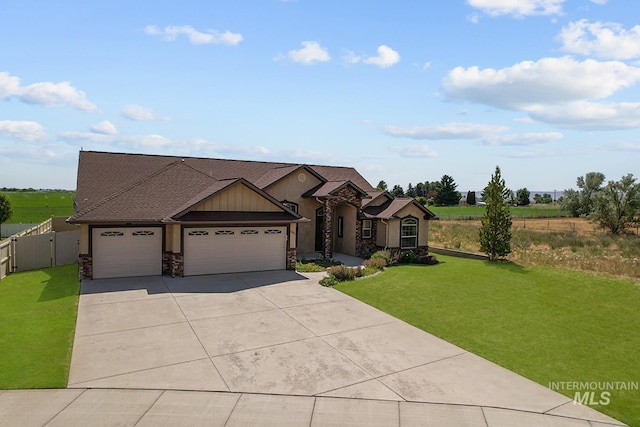 1041 Lupine Ln, Kimberly, ID 83341 - view of front of property with stone siding, an attached garage, driveway, and a gate