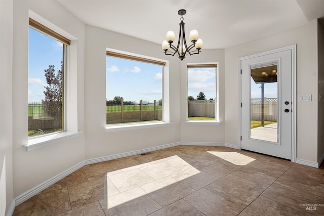 1041 Lupine Ln, Kimberly, ID 83341 - unfurnished dining area featuring a chandelier and baseboards