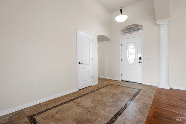 1041 Lupine Ln, Kimberly, ID 83341 - foyer entrance with inlaid floor details, decorative columns, and high vaulted ceiling