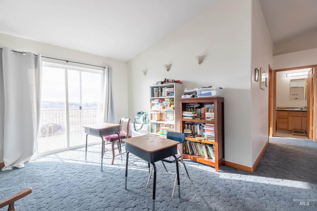 carpeted office with lofted ceiling