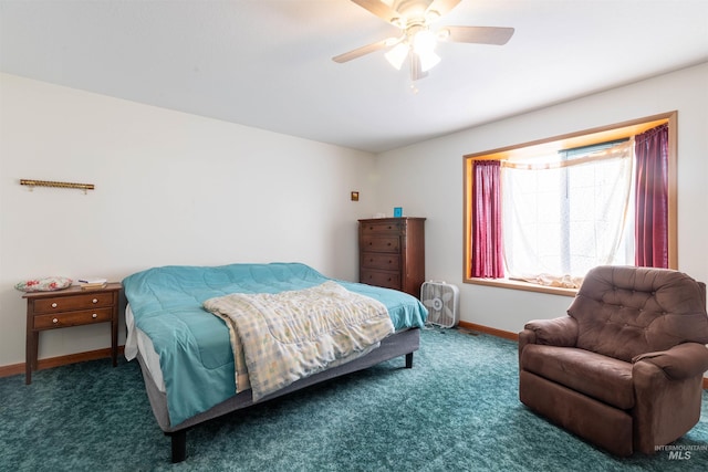 bedroom featuring ceiling fan and dark carpet