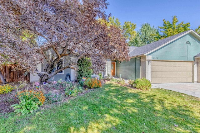 ranch-style home with a front yard and a garage