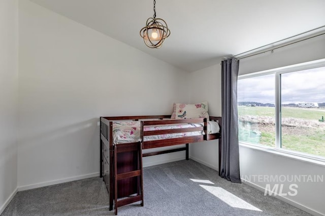 carpeted bedroom with baseboards