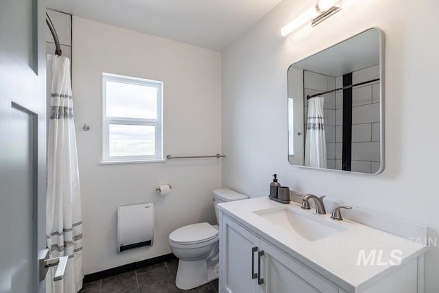 bathroom featuring tile patterned floors, heating unit, toilet, and vanity