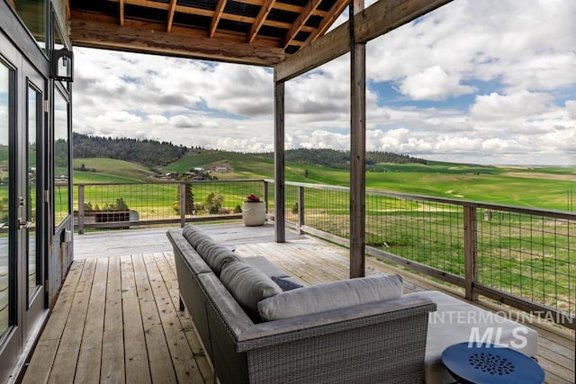 wooden deck with view of golf course