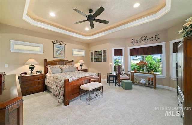 10318 W Adirondack Ct, Star, ID 83669 - bedroom with a raised ceiling, light colored carpet, ornamental molding, recessed lighting, and baseboards
