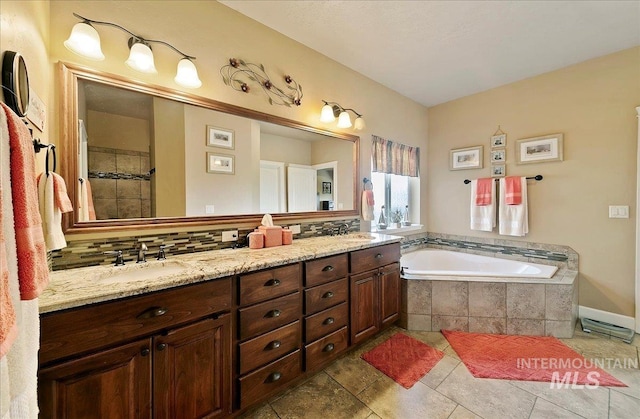 10318 W Adirondack Ct, Star, ID 83669 - full bath with double vanity, a bath, tasteful backsplash, and tiled shower