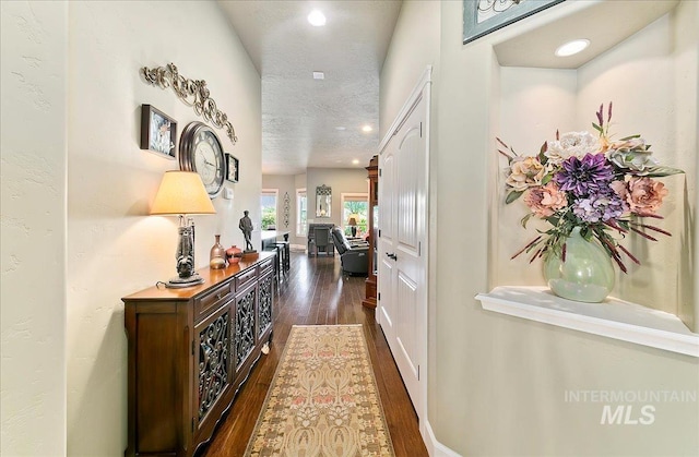 10318 W Adirondack Ct, Star, ID 83669 - hallway featuring dark wood finished floors, a textured ceiling, and recessed lighting