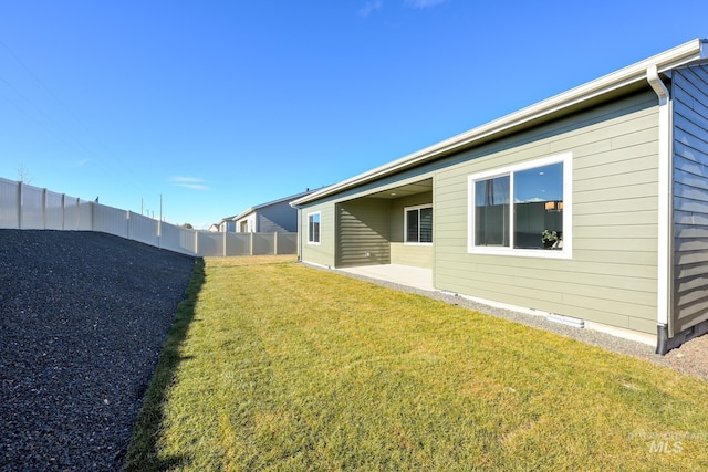 view of yard featuring a patio and a fenced backyard