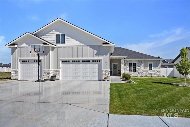 942 Paintbrush, Kimberly, ID 83341 - view of front facade featuring board and batten siding, stone siding, concrete driveway, and an attached garage
