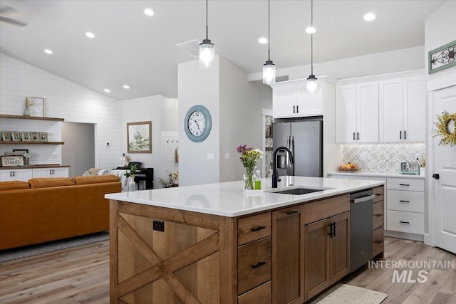 942 Paintbrush, Kimberly, ID 83341 - kitchen with a sink, appliances with stainless steel finishes, light wood finished floors, white cabinetry, and vaulted ceiling