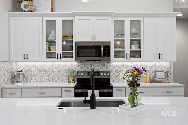 942 Paintbrush, Kimberly, ID 83341 - kitchen with stainless steel appliances, white cabinets, and light stone countertops