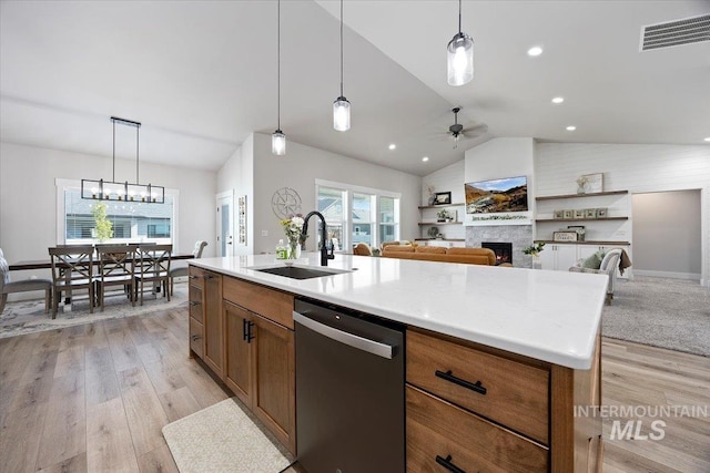 942 Paintbrush, Kimberly, ID 83341 - kitchen featuring stainless steel dishwasher, a sink, lofted ceiling, light wood-style floors, and ceiling fan