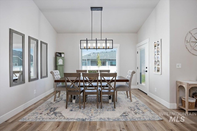 942 Paintbrush, Kimberly, ID 83341 - dining area with a chandelier, wood finished floors, and baseboards
