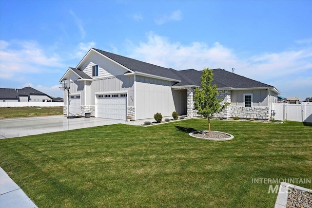 942 Paintbrush, Kimberly, ID 83341 - view of front of property featuring board and batten siding, stone siding, driveway, and an attached garage