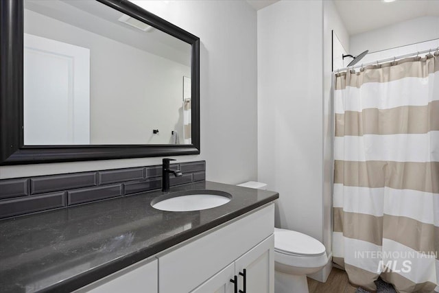 942 Paintbrush, Kimberly, ID 83341 - full bath with vanity, toilet, a shower with curtain, and wood finished floors