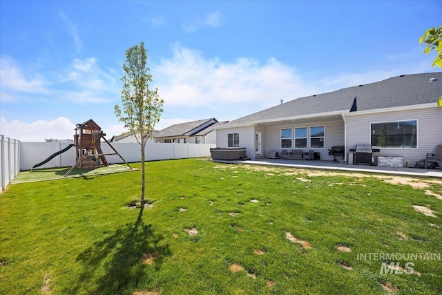 942 Paintbrush, Kimberly, ID 83341 - view of yard featuring a hot tub, a patio area, and a playground