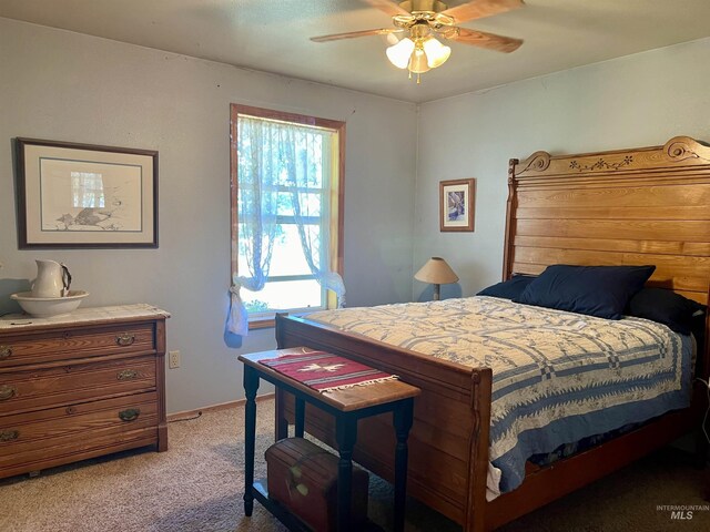 carpeted bedroom with ceiling fan