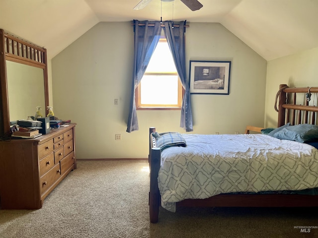 carpeted bedroom featuring ceiling fan and vaulted ceiling