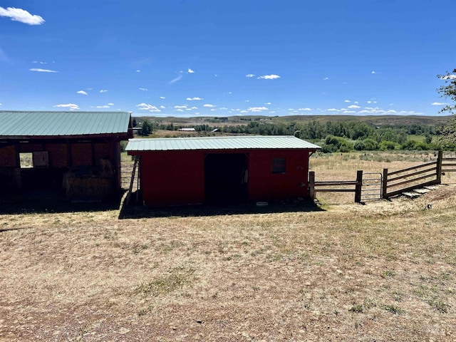 view of outbuilding featuring a rural view