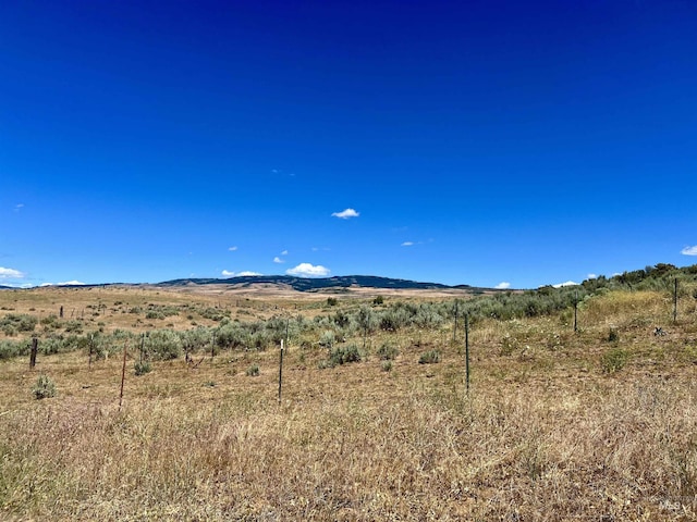 property view of mountains featuring a rural view