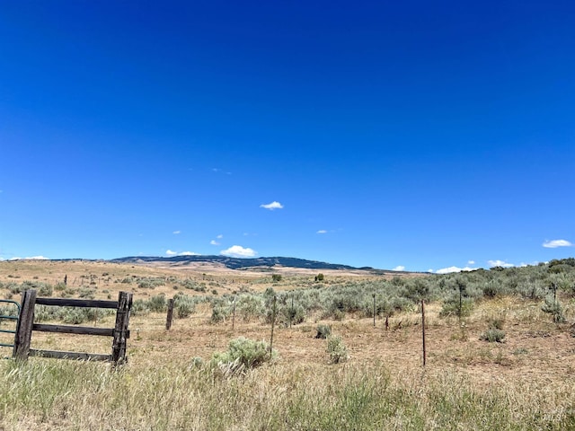 view of mountain feature with a rural view