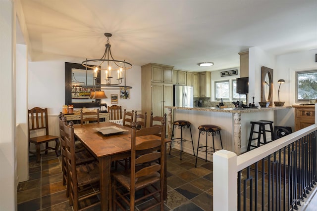 2639 Ridge Ln, Sun Valley, ID 83353 - dining room with a chandelier and dark stone finish floors