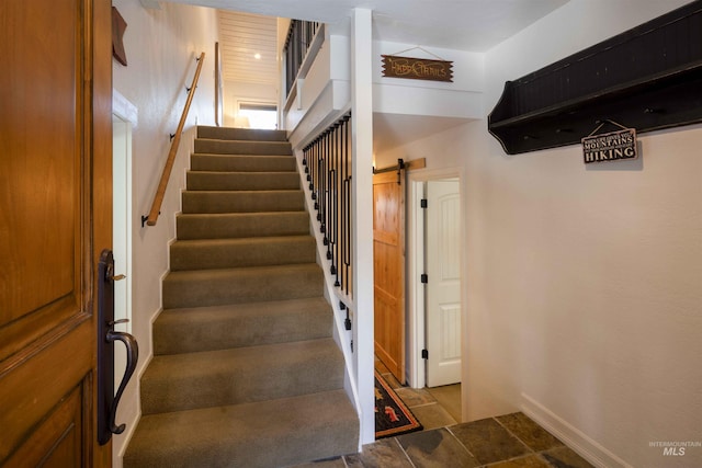2639 Ridge Ln, Sun Valley, ID 83353 - staircase featuring a barn door and stone finish floors