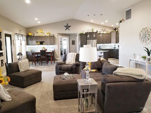 3847 N 2456 E, Filer, ID 83328 - living room with recessed lighting, high vaulted ceiling, light wood finished floors, and visible vents