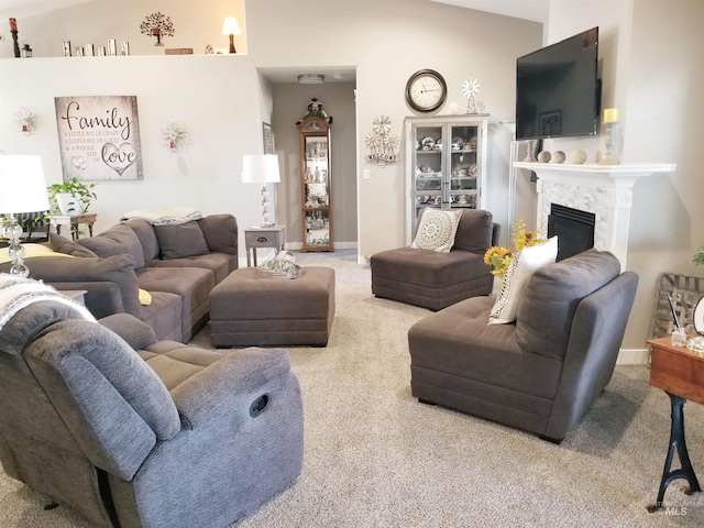 3847 N 2456 E, Filer, ID 83328 - living room with baseboards, a fireplace, and carpet floors