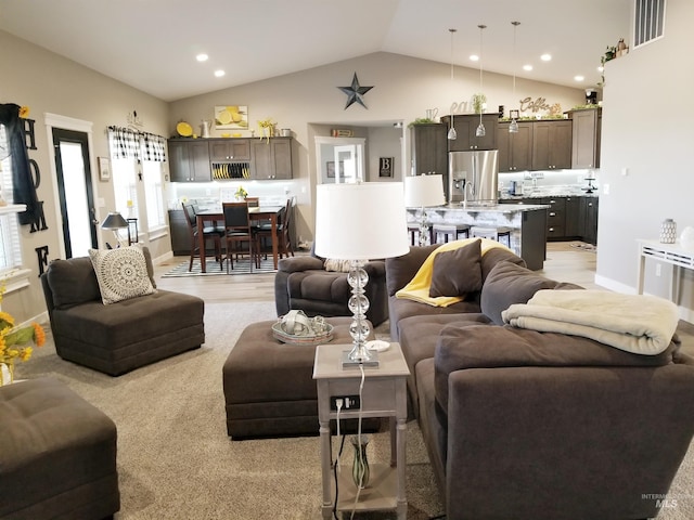 3847 N 2456 E, Filer, ID 83328 - living room featuring visible vents, baseboards, vaulted ceiling, and recessed lighting