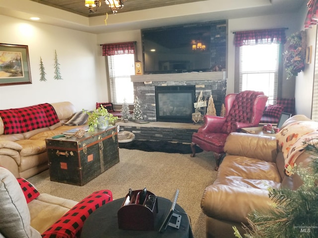 3847 N 2456 E, Filer, ID 83328 - living room with carpet flooring, a raised ceiling, and a stone fireplace