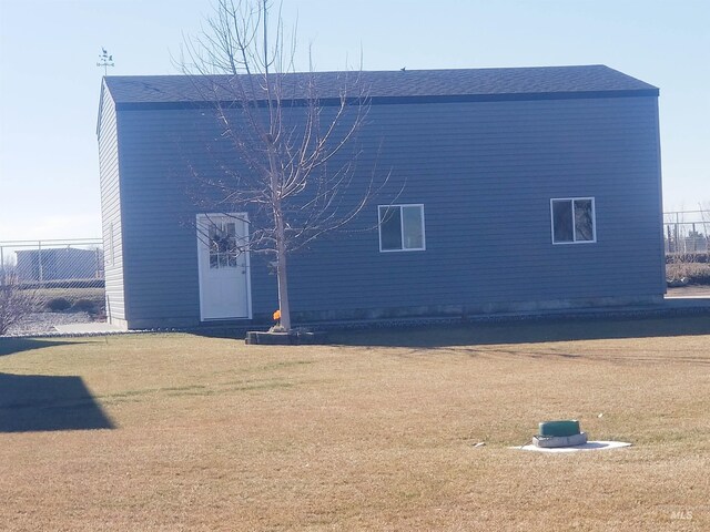 3847 N 2456 E, Filer, ID 83328 - back of house featuring a lawn and roof with shingles