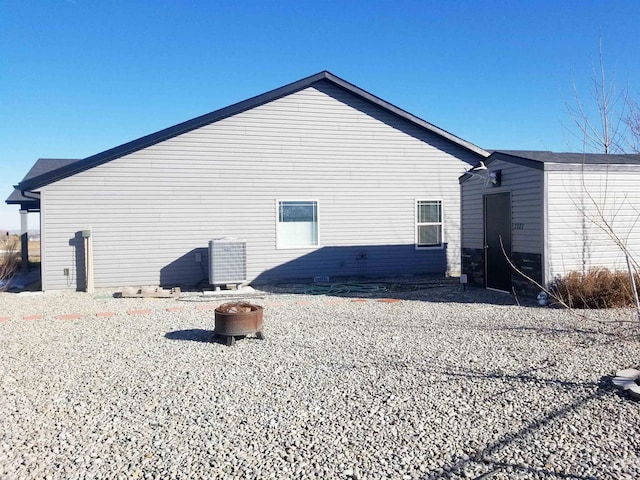 3847 N 2456 E, Filer, ID 83328 - rear view of house featuring a fire pit and cooling unit