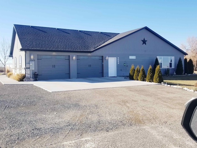 3847 N 2456 E, Filer, ID 83328 - view of front facade with driveway, a shingled roof, and an attached garage